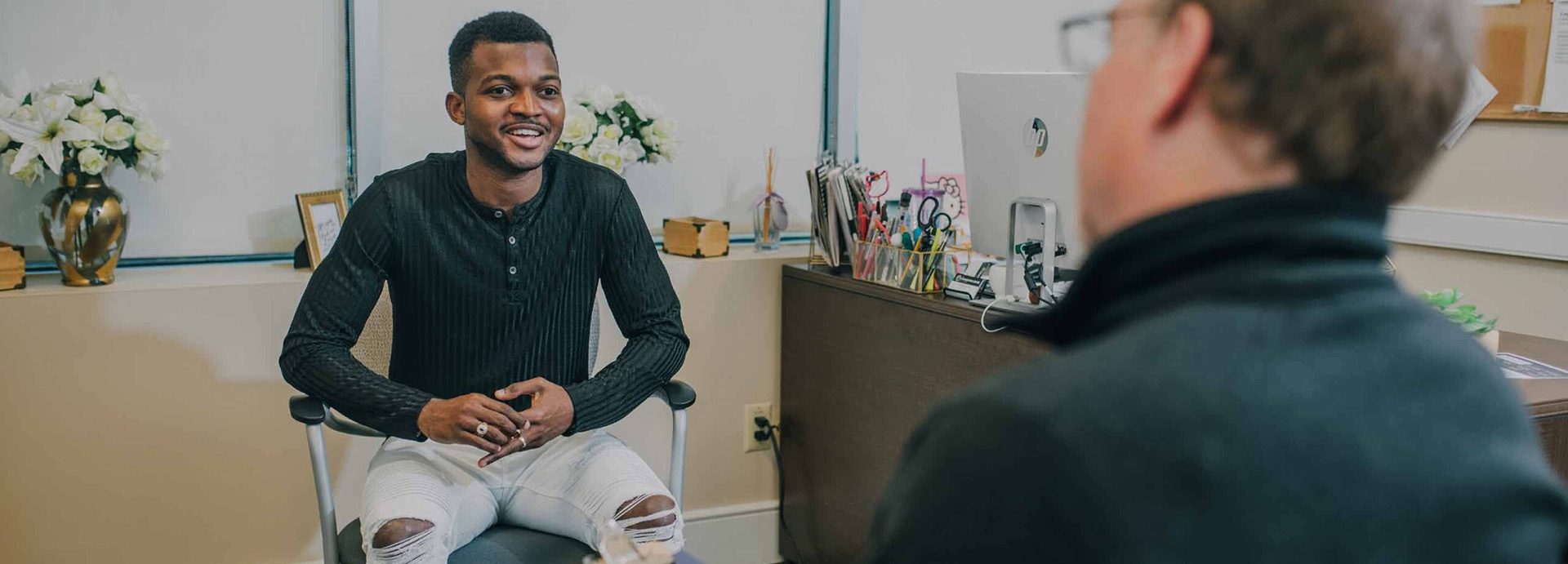 A Man Engaging in conversation at The Counseling Center